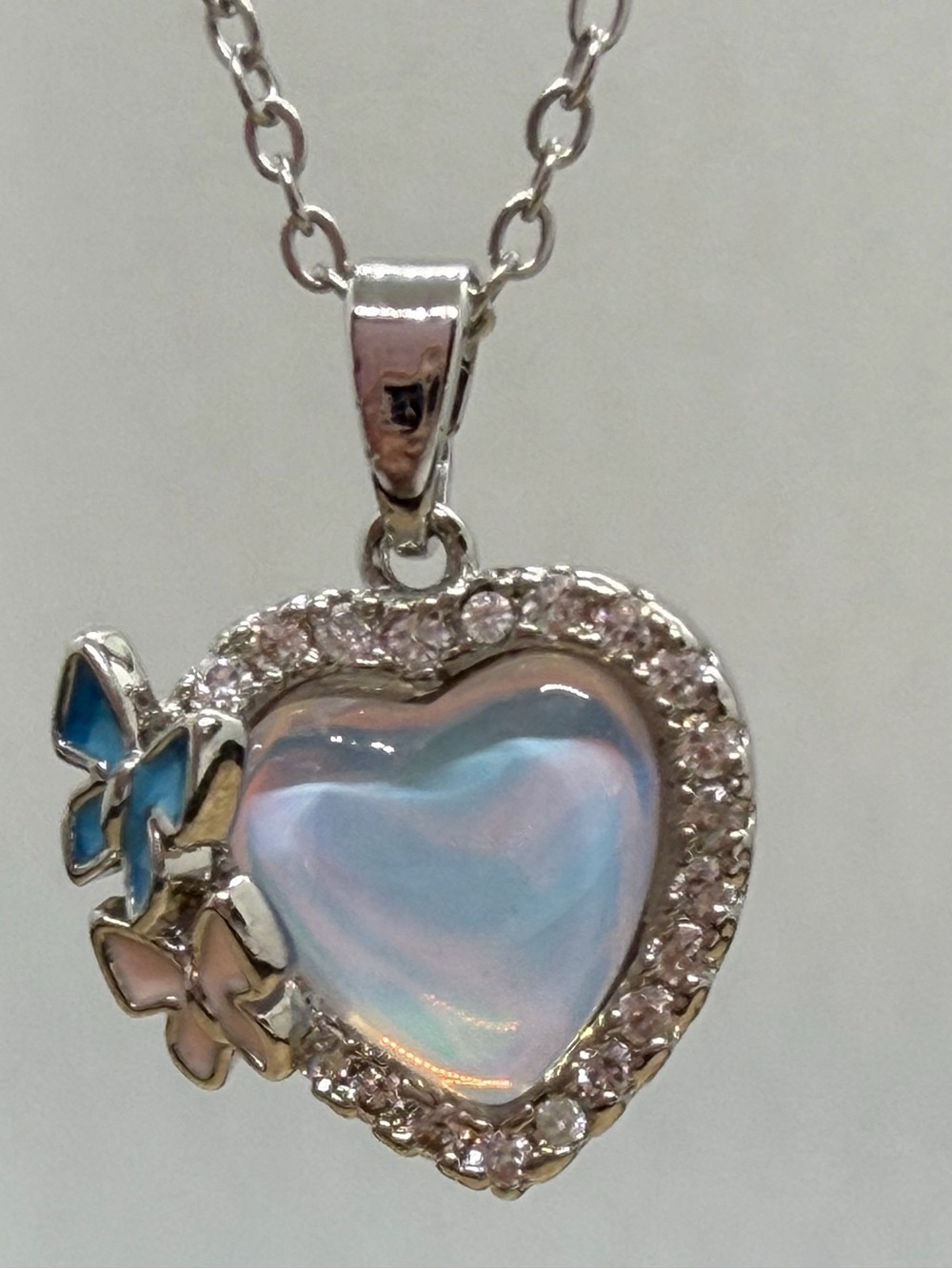 Iridescent Blue Heart Pendant Necklace with Butterfly Accents